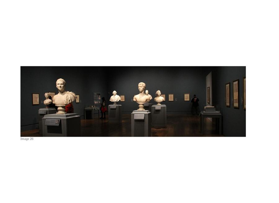 Journey — book page: a dark gallery hung with framed works.