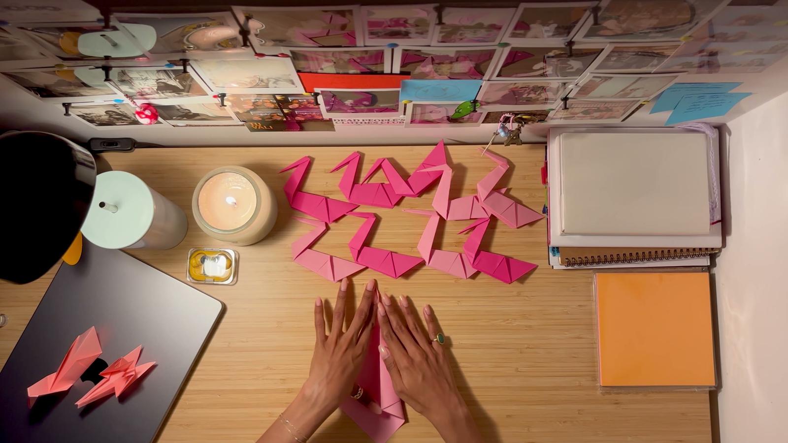 The Tenth Swan — overhead still of the origami-swan performance